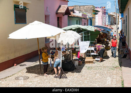 TRINIDAD, CUBA, MAY 8, 2014. Clothes and souvenirs for sale in the street in Trinidad, Cuba, on May 8th, 2014. Stock Photo