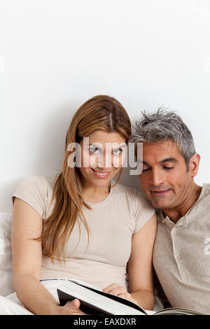 couple viewing a photo album Stock Photo