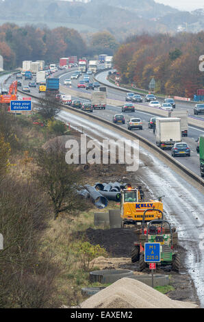 Heavy motorway traffic going through road works on the M1 in Derbyshire junction 28 to 29. Stock Photo