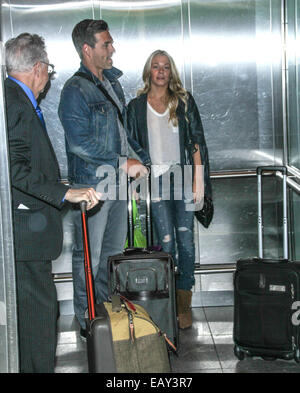 Country singer LeAnn Rimes and husband Eddie Cibrian arriving at John F. Kennedy International Airport (JFK)  Featuring: Leann Rimes,Eddie Cibrian Where: New York City, New York, United States When: 19 May 2014 Stock Photo