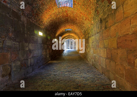 Brick tunnel with light in the end Stock Photo