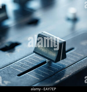 Crossfader on dj mixer in club, closeup Stock Photo