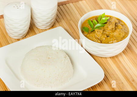 Closeup view of rice served with delicious Indian mutton curry. Stock Photo