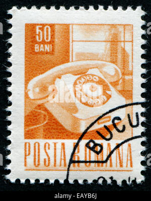 ROMANIA - CIRCA 1967: A stamp printed in Romania Shows Telephone, circa 1967 Stock Photo