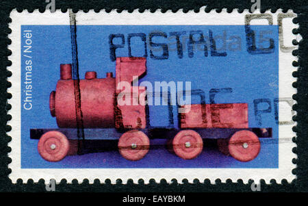 CANADA - CIRCA 1981: A stamp printed in Canada shows image of a child's toy train, series, circa 1981 Stock Photo