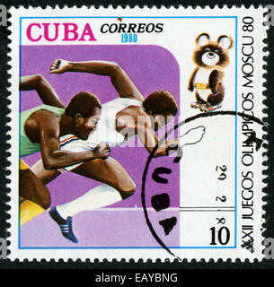 CUBA - CIRCA 1980: A stamp printed by the Cuban Post is devoted to the Olympic Games in Moscow in 1980. It shows two runners Stock Photo