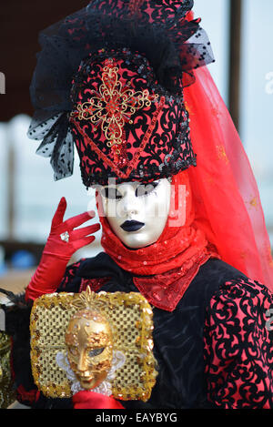 Lady and gentleman in red and white masks, Venice Carnival