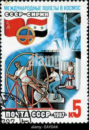 USSR - CIRCA 1987: A post stamp printed in USSR- The international space flights, circa 1987 Stock Photo