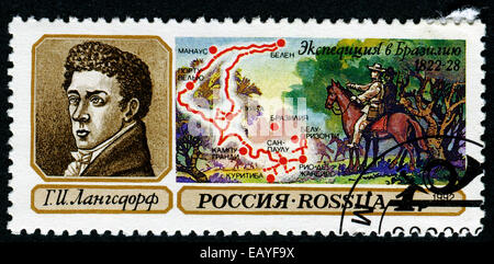 USSR - CIRCA 1992: stamp printed in USSR shows portrait of langedorf and map of Brazil Stock Photo