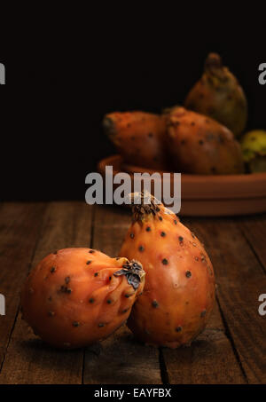 Prickly Pears on wooden Table Stock Photo
