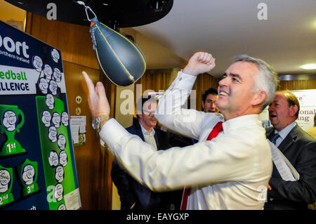 Belfast, Northern Ireland. 22nd Nov, 2014. Junior Minister Jonathan Bell hits a punchbag at the 2014 DUP Conference Credit:  Stephen Barnes/Alamy Live News Stock Photo