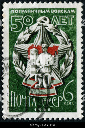 USSR - CIRCA 1968: A stamp printed in USSR shows border guard, circa 1968 Stock Photo