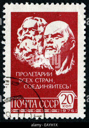 USSR - CIRCA 1976: A stamp printed in USSR shows portret of coutry head with friend, name Lenin, circa 1976 Stock Photo