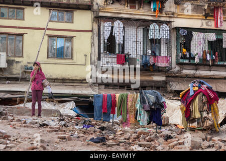 Indian youth playing on a building site, Mumbai, India Stock Photo