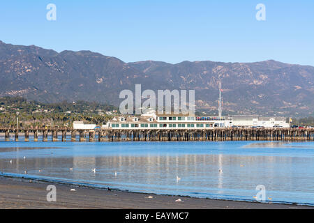A view of historic Stearns Wharf framed against the mountains of Santa Barbara, California. Stock Photo
