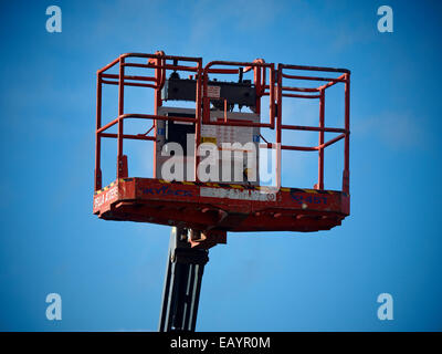 Cherry picker basket isolated against blue sky Stock Photo - Alamy