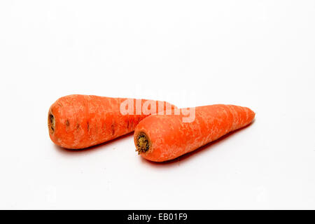 Healthful carrots, which are rich source of beta-carotene and fiber, isolated on white Stock Photo
