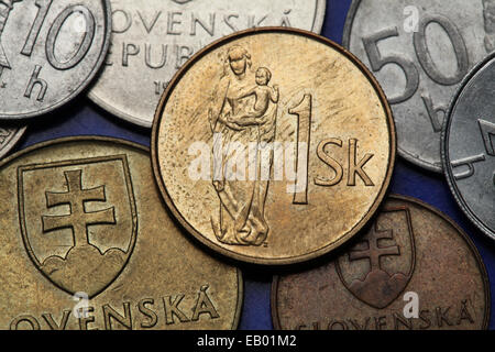 Coins of Slovakia. Gothic wooden sculpture of Madonna with child depicted on the Slovak one koruna coin. Stock Photo