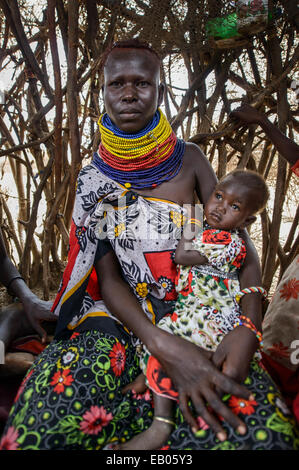 Turkana woman with Baby wearing traditional necklaces, Kenya Stock Photo