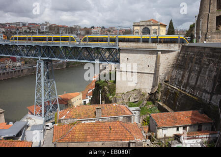 Metro on Dom Luis I Bridge in historic city centre of Porto in Portugal. Stock Photo