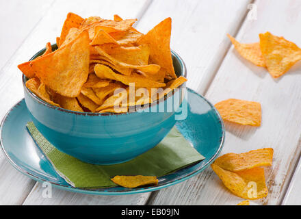 Corn chips on a wooden table. Selective focus Stock Photo
