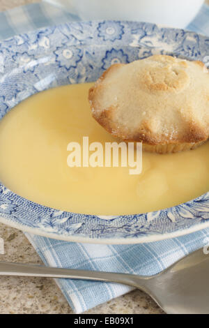Mini apple pie and custard Stock Photo