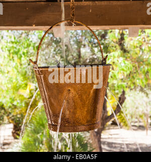 Very peculiar fountain with an old Far West design. Useful for concepts. Stock Photo