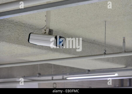cctv camera on the ceiling in parking lot Stock Photo