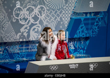 Yulia Lipnitskaya (RUS) and her coach Eteri Tutberidze in the kiss and cry area after competiting in the Figure Skating Free Ska Stock Photo