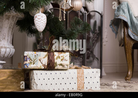 Close up Beautiful Christmas Gifts Below Attractive Christmas Tree with Various Decorations. Stock Photo