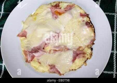fried eggs with ham and cheese Stock Photo