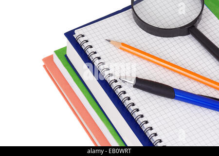 books, notebook, magnifying glass and pen isolated on white background Stock Photo
