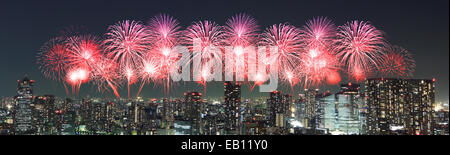 Fireworks celebrating over Tokyo cityscape at night, Japan (panorama) Stock Photo