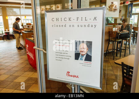 Florida,Palm Bay,Chick-fil-A,restaurant restaurants food dining cafe cafes,fast food,interior inside,entrance,sign,closed Sunday,policy,S. Truett Cath Stock Photo