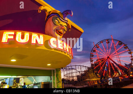 Daytona Beach Florida,night nightlife evening after dark,Boardwalk,Ferris wheel,Fun Center,centre,Mardi gras face mask,roller coaster,visitors travel Stock Photo