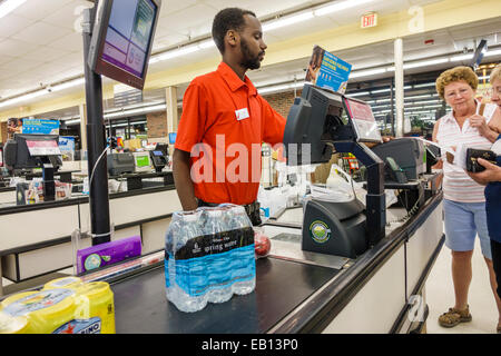 Daytona Beach Florida,Winn grocery store,supermarket,interior inside,sale,checkout line queue,Black Blacks African Africans ethnic minority,adult adul Stock Photo