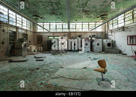 The laundry facilities in an abandoned hospital. Ontario, Canada. Stock Photo