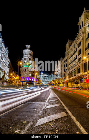 MADRID, SPAIN - DECEMBER 20: Madrid at Christmas. Rays of traffic lights on Gran via street, main shopping street in Madrid Stock Photo