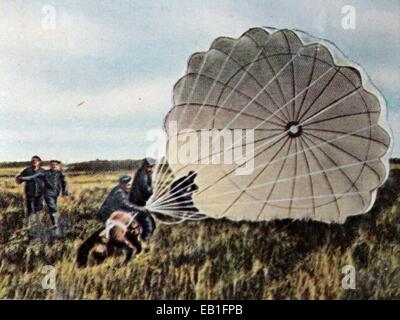 WW2 Propaganda photo of German parachutist jumping from plane
