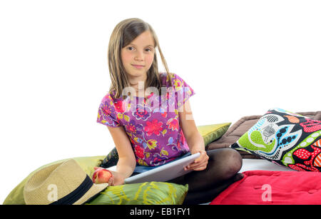 girl with a digital tablet and an apple in his hand Stock Photo