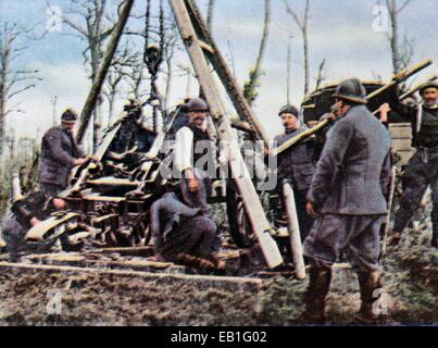 The contemporary colorized German propaganda photo shows French soldiers setting up a heavy artillery gun near Verdun, France, 1916. The battle of Verdun between the German Empire and France lasted from 21 February until 20 December 1916. It became a symbol of the tragic pointlessness of trench warfare for the Germans and French. Photo: Neumann Archive - NO WIRE SERVICE Stock Photo