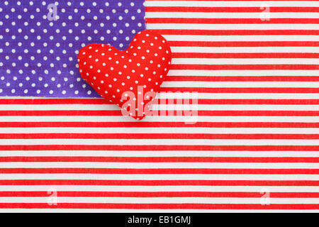 Blue polka dots and Red/white Striped Fabrics as American flag. Stuffed handmade heart Stock Photo