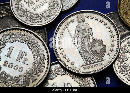 Coins of Switzerland. Standing Helvetia depicted in the Swiss one franc coins. Stock Photo