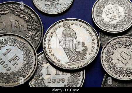 Coins of Switzerland. Standing Helvetia depicted in the Swiss one franc coins. Stock Photo