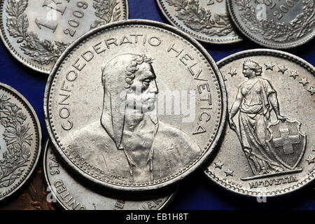 Coins of Switzerland. Alpine herdsmen and standing Helvetia depicted in the Swiss franc coins. Stock Photo