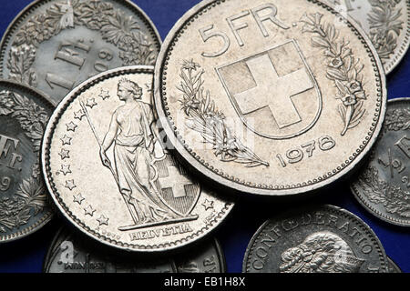 Coins of Switzerland. Coat of arms of Switzerland depicted in the Swiss five franc coin. Stock Photo