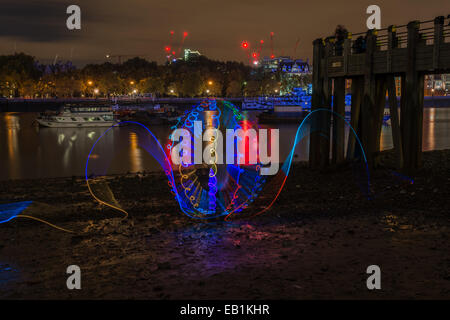 Light painting photography on the Thames beach at night - abstract pattern Stock Photo