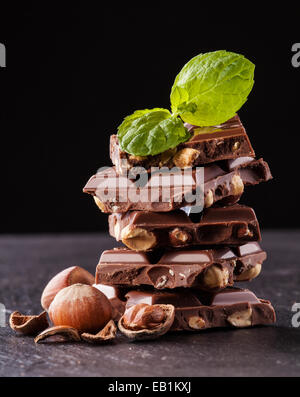 Pile of hazelnut chocolate isolated on black background Stock Photo