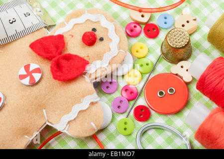 Sewing set and handmade gingerbread man from textile Stock Photo