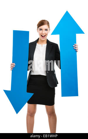 Beautiful young business woman holding a blue arrows, over a white background Stock Photo